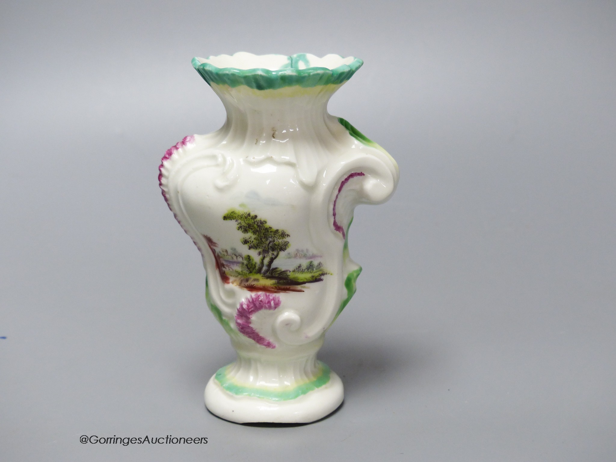 An 18th century Derby asymmetric vase painted with two landscapes, height 12.5cm